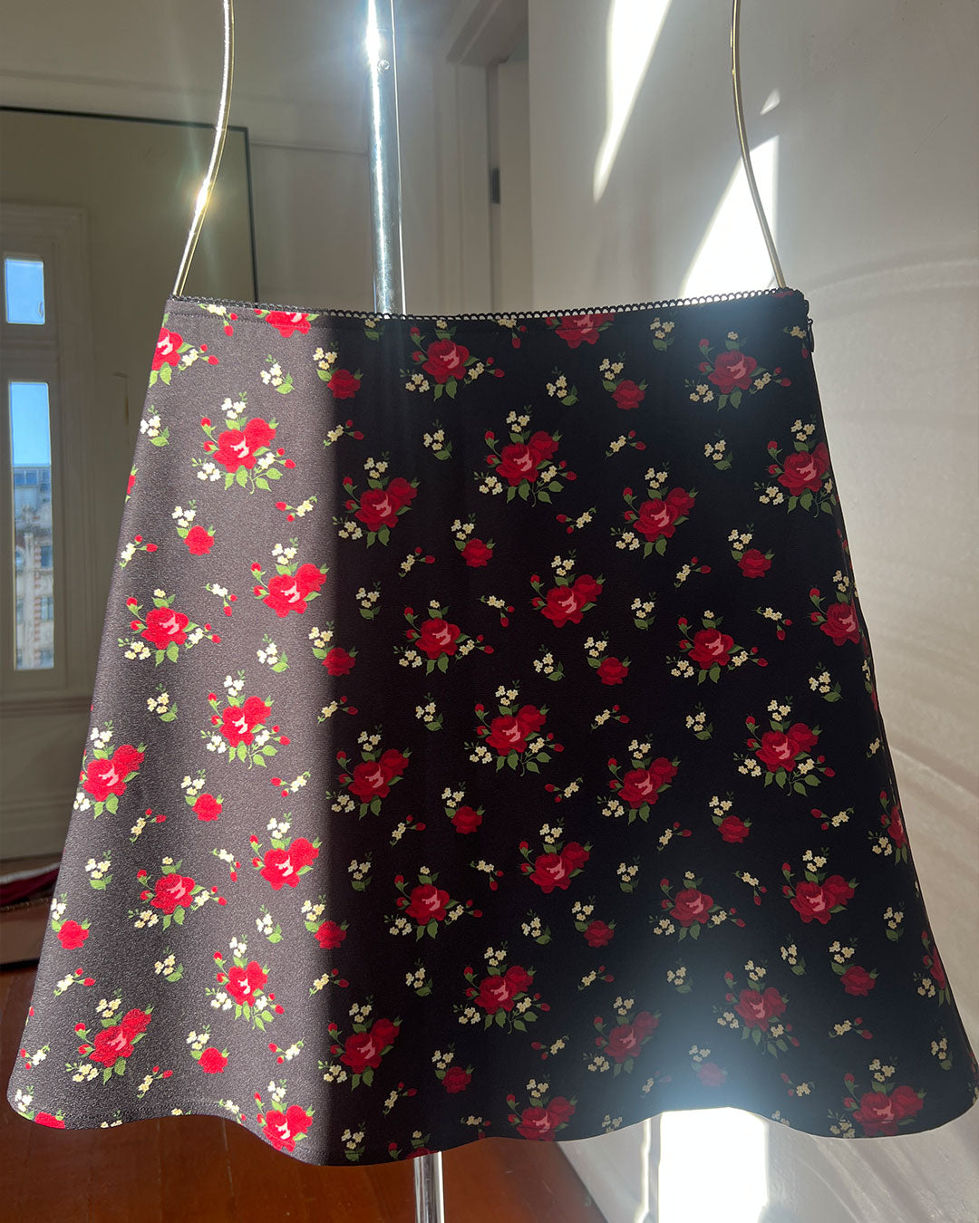 Hazel Midi Skirt in Fleur knee-length A line black floral skirt with side zipper and scalloped lace waistband