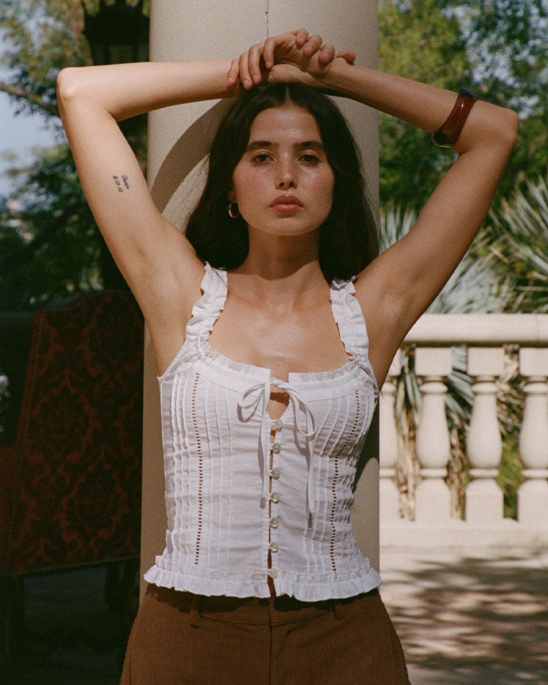 Eliza Top in Bianco white resort blouse with lace paneling, button-up front, and ruffled hem