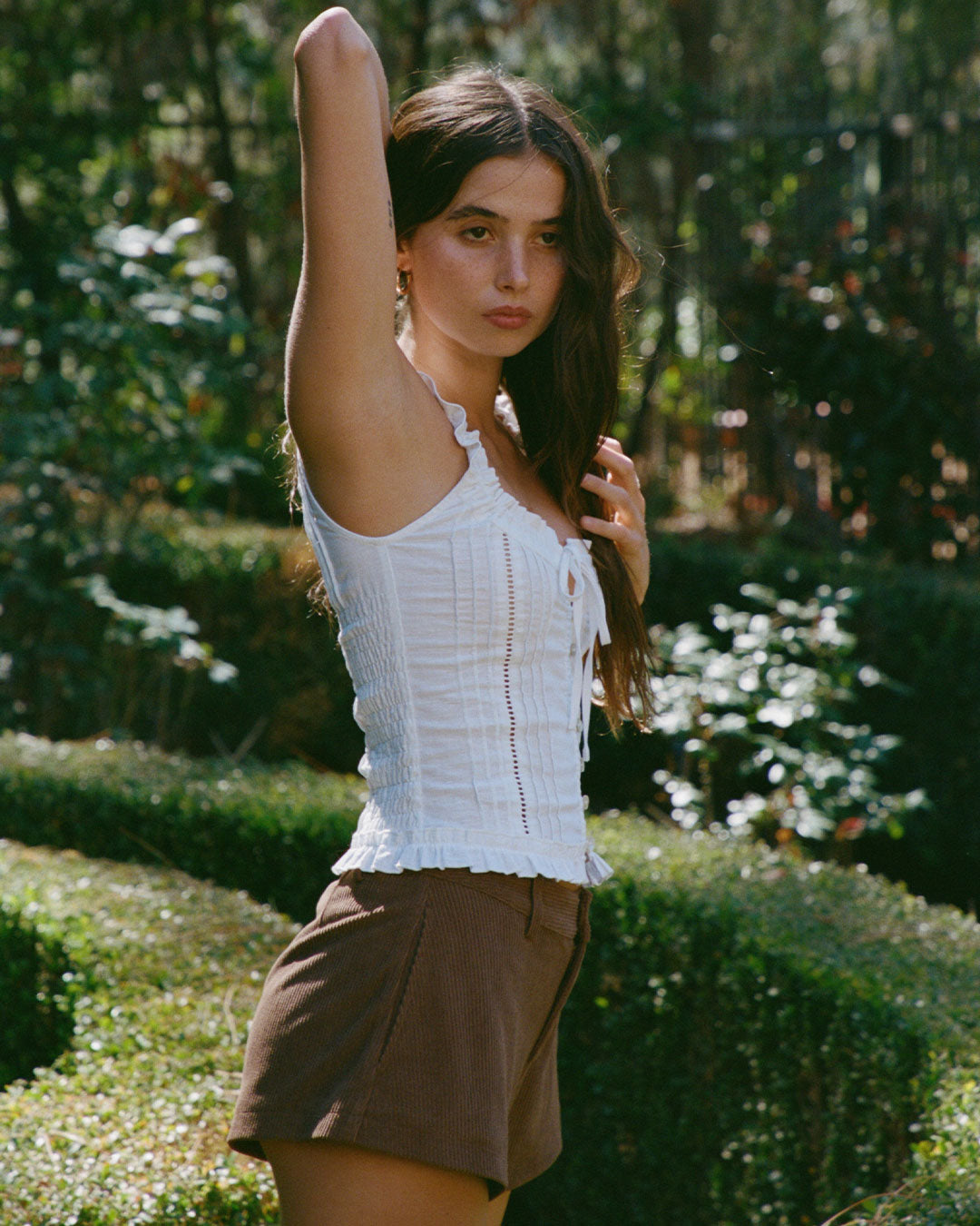 Eliza Top in Bianco white resort blouse with lace paneling, button-up front, and ruffled hem