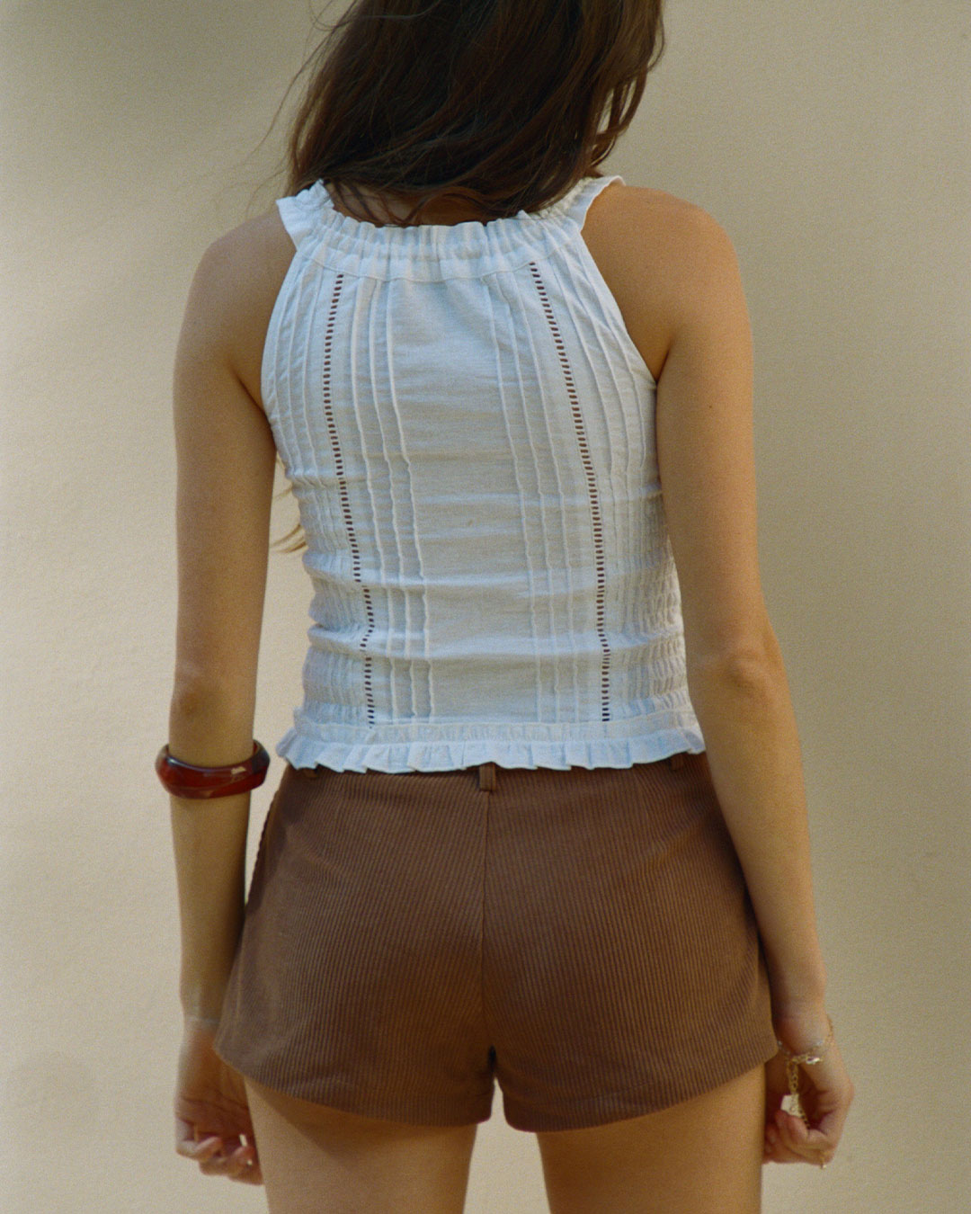 Eliza Top in Bianco white resort blouse with lace paneling, button-up front, and ruffled hem